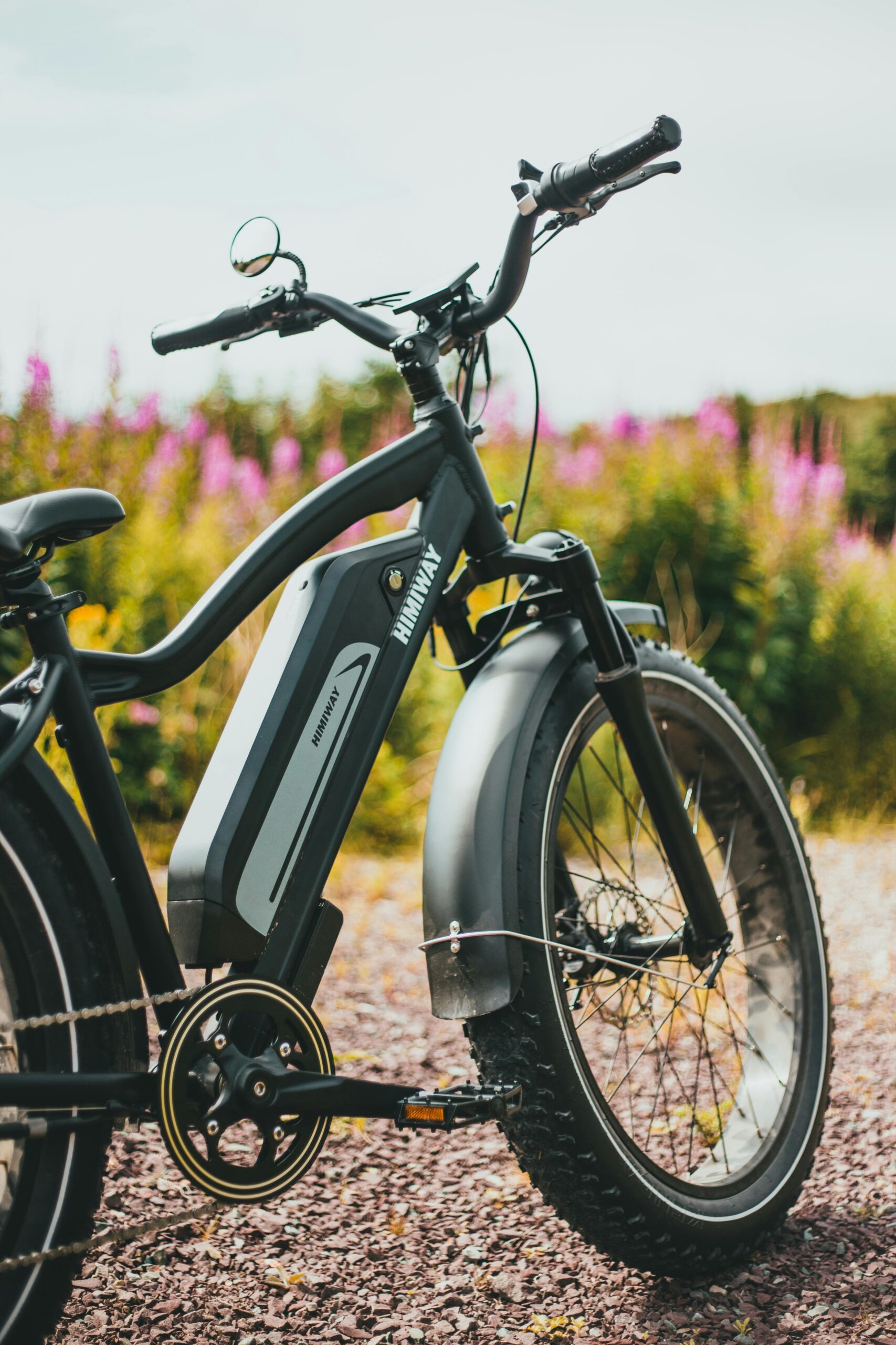 Close-up of a parked bicycle with a blurred natural background, perfect outdoor adventure image.